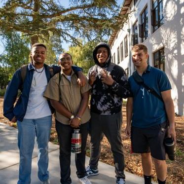 Students standing together smiling